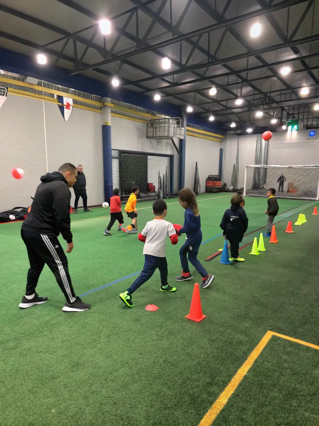 A dynamic image of a training session for young sports enthusiasts, highlighting the organization's focus on skill development and mentorship.